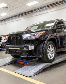 Toyota on vehicle lift | Oakbrook Toyota in Westmont in Westmont IL